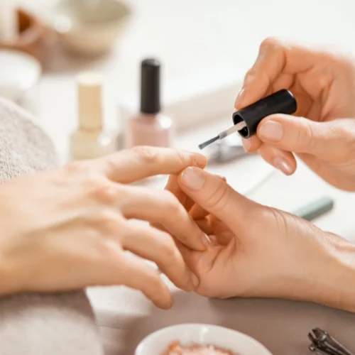 Ladies nail polish services Dubai with flawless color application at home