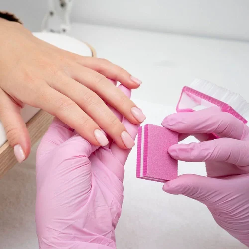 Smooth natural nails after dip buff service in Dubai for ladies