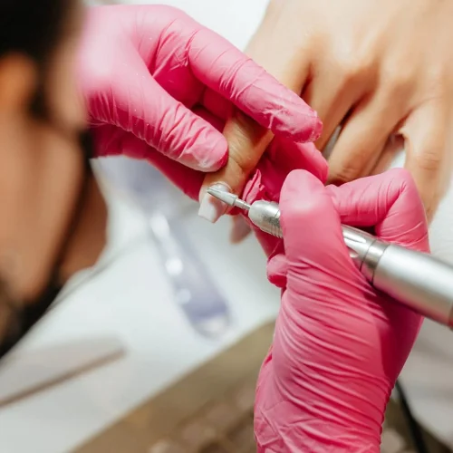 Filled cuticle regrowth on ladies nail extension at home Dubai showing seamless blend